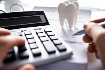: A patient calculating the cost of teeth whitening