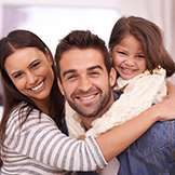 family of three laughing