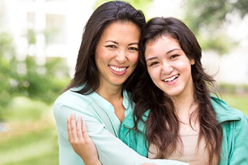 Mother and daughter laughing