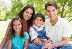 Smiling family in park