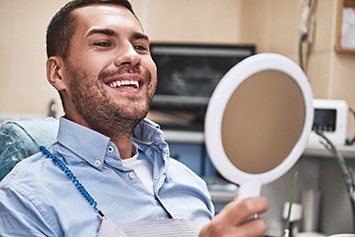 Man smiling after visiting cosmetic dentist in Waco