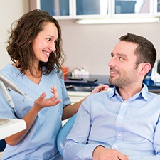 Dentist discussing cost of cosmetic dentistry in Waco with patient