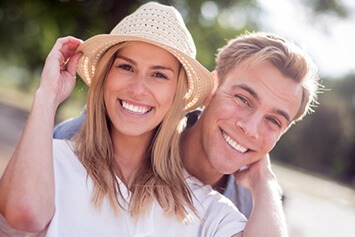 Couple smiling showing their pearly whites