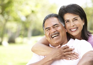 Smiling couple with dentures in Waco 