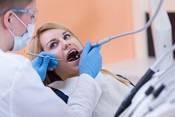 Woman receiving dental treatment