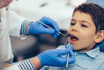 Child receiving dental treatment