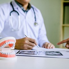 person looking at dental insurance information on their phone