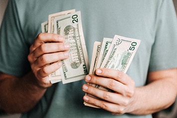 Close up of man counting cash