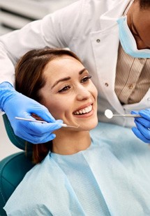 a patient smiling after undergoing restorative dentistry