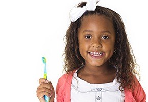 little girl with toothbrush