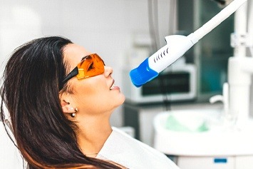 Female patient getting in-office teeth whitening 