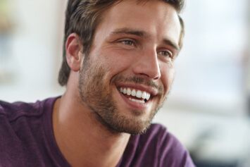Handsome male showing his white teeth