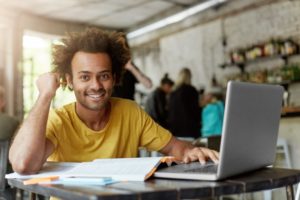 person doing research on their laptop