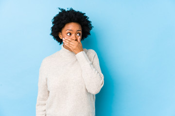 person covering their mouth with their hand